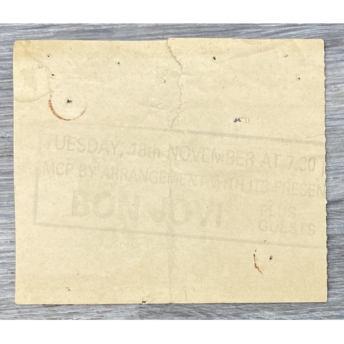 104 - An official Bon Jovi 'Slippery When Wet' 1986 tour programme together with an advance booking ticket... 