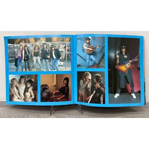 104 - An official Bon Jovi 'Slippery When Wet' 1986 tour programme together with an advance booking ticket... 