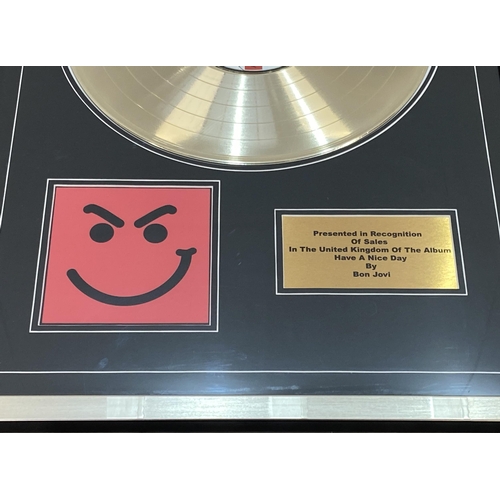 2 - A signed limited edition gold record presentation recognizing sales of the album 'Have A Nice Day' b... 