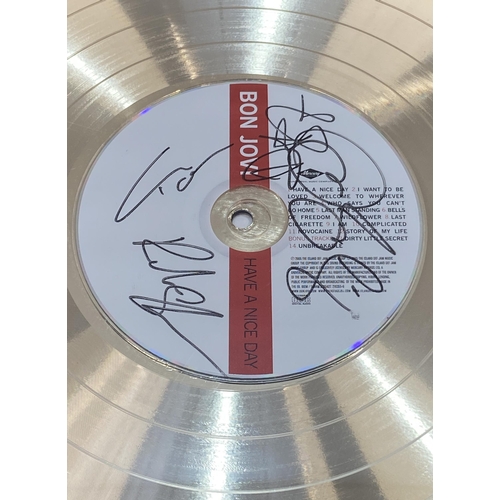 2 - A signed limited edition gold record presentation recognizing sales of the album 'Have A Nice Day' b... 