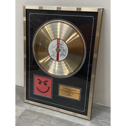 2 - A signed limited edition gold record presentation recognizing sales of the album 'Have A Nice Day' b... 