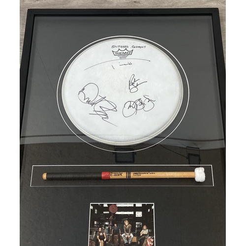 3 - A Bon Jovi framed memorabilia display featuring an official drumhead and drumstick used by Tico Torr... 
