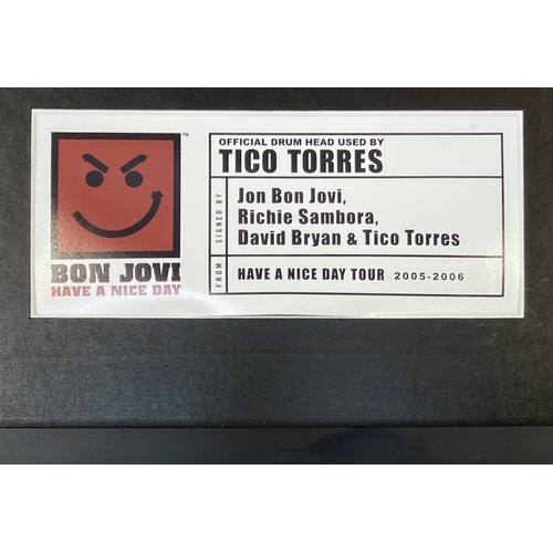 3 - A Bon Jovi framed memorabilia display featuring an official drumhead and drumstick used by Tico Torr... 