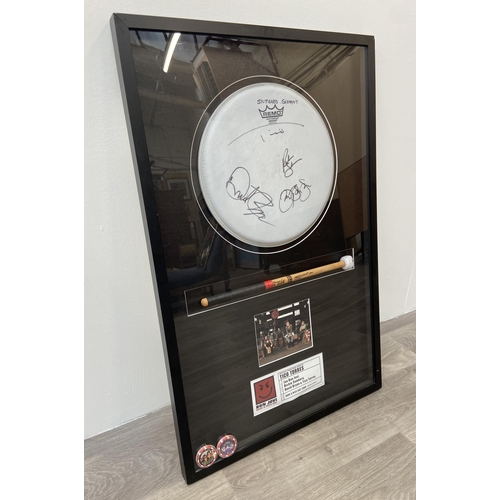 3 - A Bon Jovi framed memorabilia display featuring an official drumhead and drumstick used by Tico Torr... 