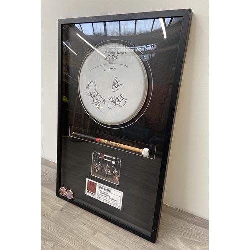 3 - A Bon Jovi framed memorabilia display featuring an official drumhead and drumstick used by Tico Torr... 