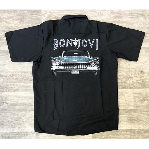 30 - Two items of staff workwear from Bon Jovi's Because We Can Tour in 2013: One navy blue jacket made b... 