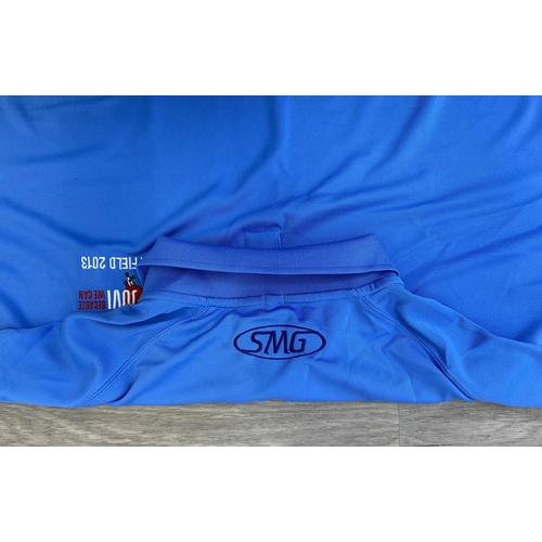 32 - Two items of staff workwear from Bon Jovi's Because We Can Tour in 2013: one Nike Dri-Fit blue polo ... 