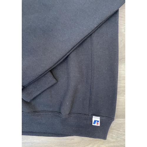 32 - Two items of staff workwear from Bon Jovi's Because We Can Tour in 2013: one Nike Dri-Fit blue polo ... 
