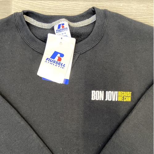 32 - Two items of staff workwear from Bon Jovi's Because We Can Tour in 2013: one Nike Dri-Fit blue polo ... 