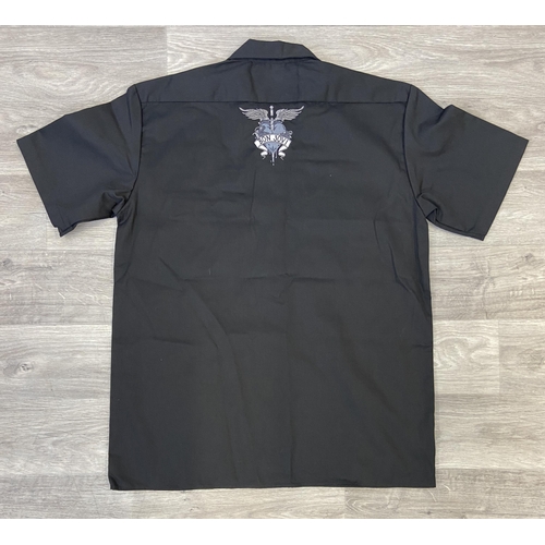 34 - Two items: one black Dickies short-sleeve work shirt featuring an embroidered Bon Jovi logo above th... 