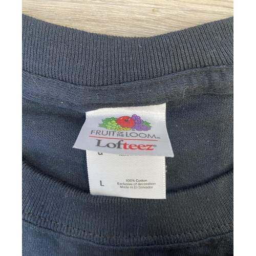 35 - Two items of staff workwear both feature a graphic for Upstaging Inc., a well-known lighting and sta... 