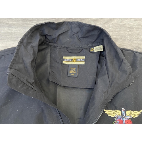 41 - A Bon Jovi windbreaker jacket by North End in black features an embroidered daggered heart with wing... 
