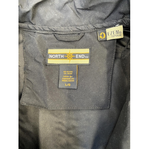 41 - A Bon Jovi windbreaker jacket by North End in black features an embroidered daggered heart with wing... 
