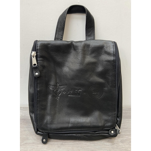 62 - Two Bon Jovi 'The Circle Tour' black leather hanging toiletry travel bags by Canyon Outback were onl... 