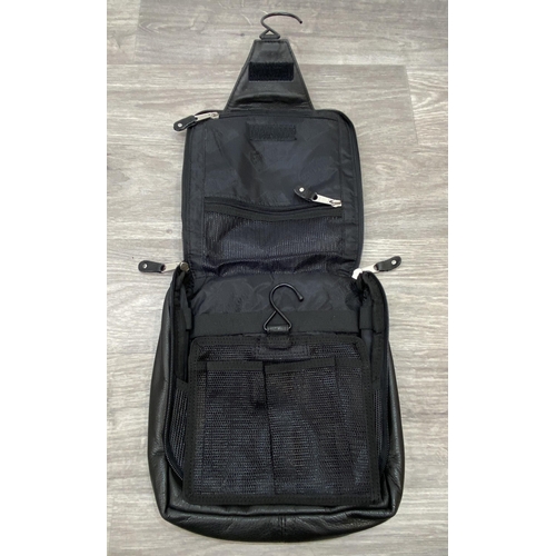 62 - Two Bon Jovi 'The Circle Tour' black leather hanging toiletry travel bags by Canyon Outback were onl... 