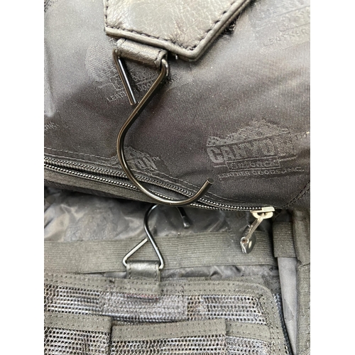 62 - Two Bon Jovi 'The Circle Tour' black leather hanging toiletry travel bags by Canyon Outback were onl... 