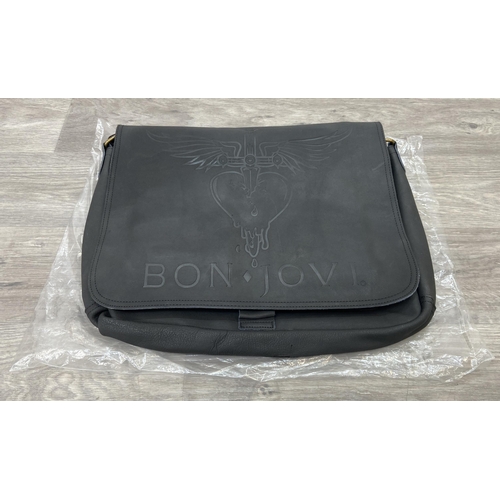 63 - A Bon Jovi 'The Circle Tour' black leather messenger bag was only given out to VIP ticket holders; i... 