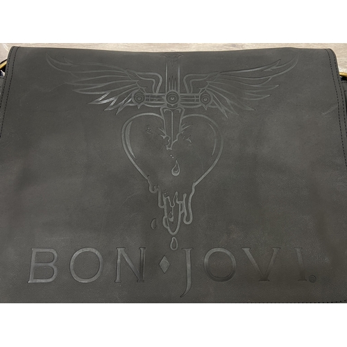 63 - A Bon Jovi 'The Circle Tour' black leather messenger bag was only given out to VIP ticket holders; i... 