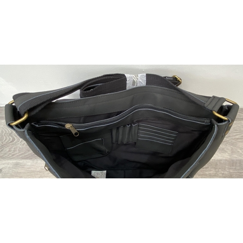 63 - A Bon Jovi 'The Circle Tour' black leather messenger bag was only given out to VIP ticket holders; i... 