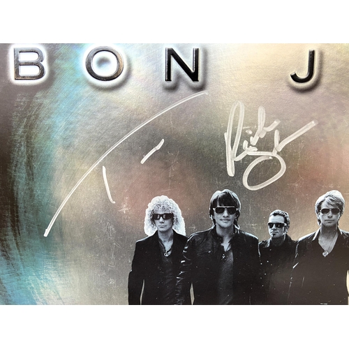 68 - A signed tour programme, Bon Jovi's 'The Circle Tour 2010-2011,' features hand-signed autographs fro... 