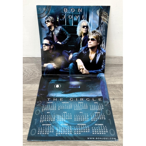 68 - A signed tour programme, Bon Jovi's 'The Circle Tour 2010-2011,' features hand-signed autographs fro... 