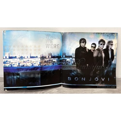 68 - A signed tour programme, Bon Jovi's 'The Circle Tour 2010-2011,' features hand-signed autographs fro... 