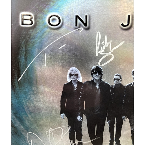 69 - A signed tour programme, Bon Jovi's 'The Circle Tour 2010-2011,' features hand-signed autographs fro... 