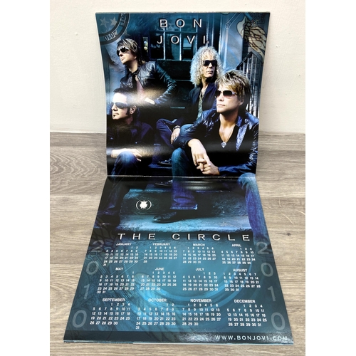 69 - A signed tour programme, Bon Jovi's 'The Circle Tour 2010-2011,' features hand-signed autographs fro... 