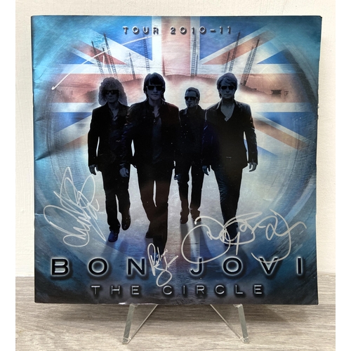 71 - A signed tour programme, Bon Jovi's 'The Circle Tour 2010-2011,' UK variant, features hand-signed au... 