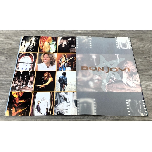 84 - Four items from Bon Jovi's 'These Days Tour': one 1995 UK tour programme featuring 24 pages of conce... 
