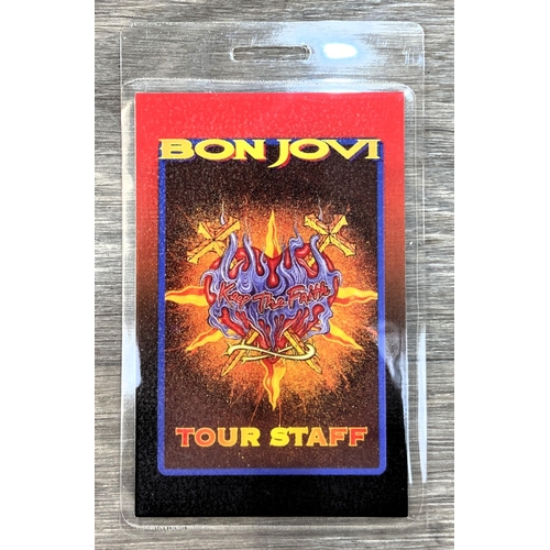 85 - An official Bon Jovi 'Keep The Faith' 1993 UK tour programme together with a laminated tour staff pa... 
