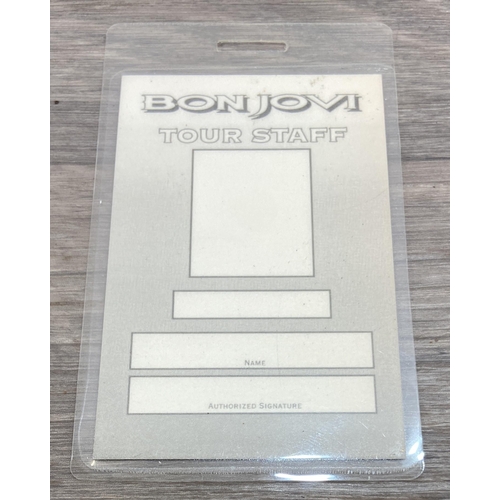 85 - An official Bon Jovi 'Keep The Faith' 1993 UK tour programme together with a laminated tour staff pa... 
