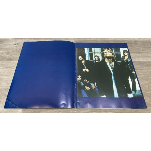 85 - An official Bon Jovi 'Keep The Faith' 1993 UK tour programme together with a laminated tour staff pa... 