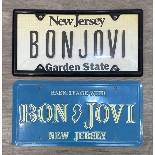 91 - Two Bon Jovi New Jersey-themed novelty license plates, one white with 