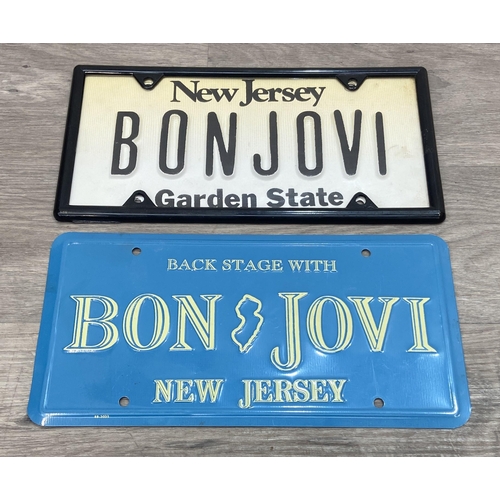 91 - Two Bon Jovi New Jersey-themed novelty license plates, one white with 