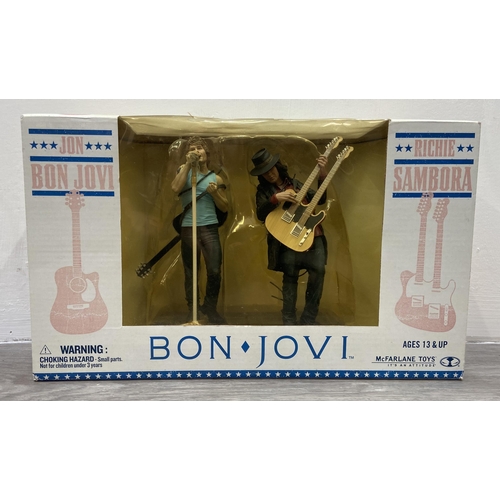 92 - A Bon Jovi two-pack collectible action figure set by McFarlane Toys, released in 2007, features Jon ... 