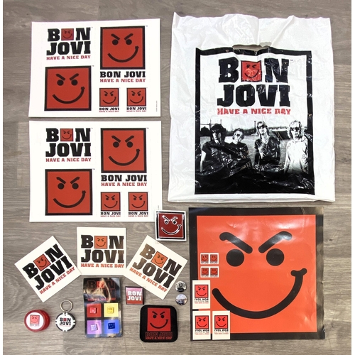95 - A collection of merchandise relating to Bon Jovi's 'Have A Nice Day,' to include a carrier bag, belt... 