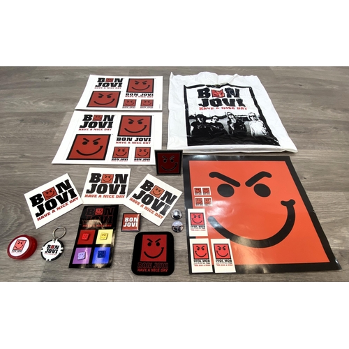 95 - A collection of merchandise relating to Bon Jovi's 'Have A Nice Day,' to include a carrier bag, belt... 