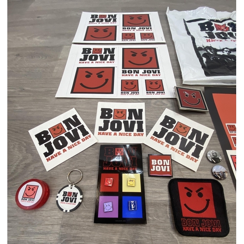 95 - A collection of merchandise relating to Bon Jovi's 'Have A Nice Day,' to include a carrier bag, belt... 