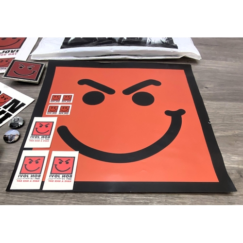 95 - A collection of merchandise relating to Bon Jovi's 'Have A Nice Day,' to include a carrier bag, belt... 