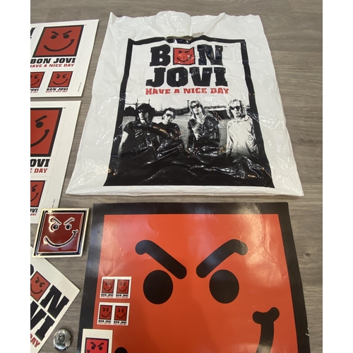 95 - A collection of merchandise relating to Bon Jovi's 'Have A Nice Day,' to include a carrier bag, belt... 