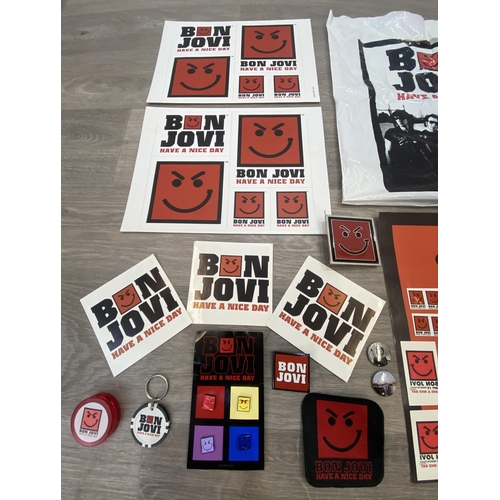 95 - A collection of merchandise relating to Bon Jovi's 'Have A Nice Day,' to include a carrier bag, belt... 