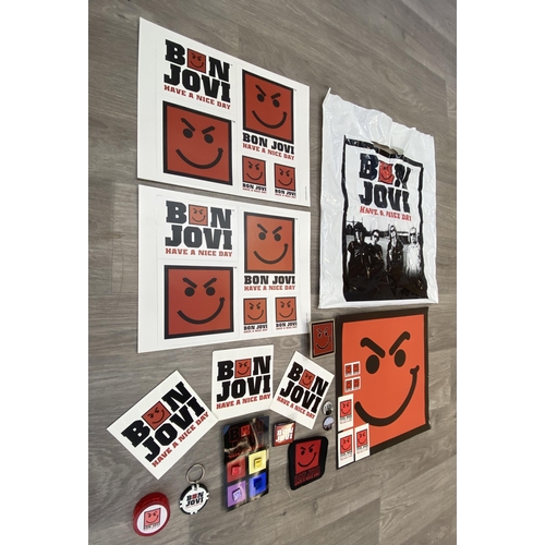 95 - A collection of merchandise relating to Bon Jovi's 'Have A Nice Day,' to include a carrier bag, belt... 