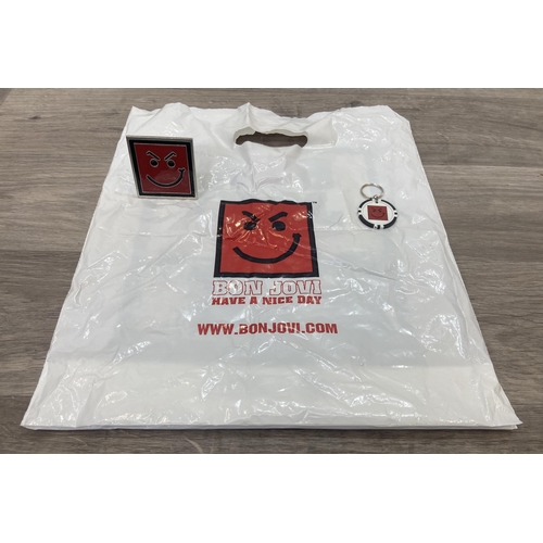 95 - A collection of merchandise relating to Bon Jovi's 'Have A Nice Day,' to include a carrier bag, belt... 