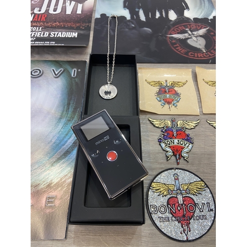 98 - Thirteen items of memorabilia from Bon Jovi's The Circle Tour 2010-2011, to include a limited editio... 