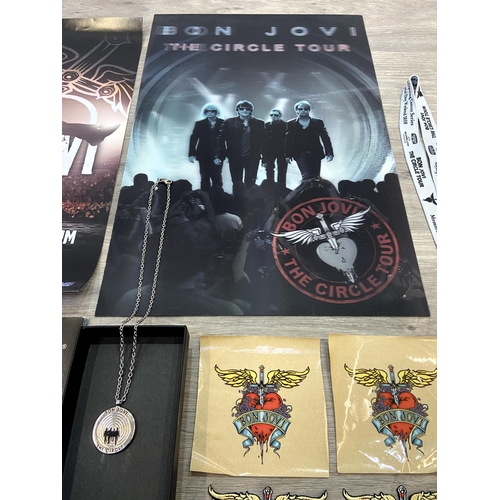 98 - Thirteen items of memorabilia from Bon Jovi's The Circle Tour 2010-2011, to include a limited editio... 