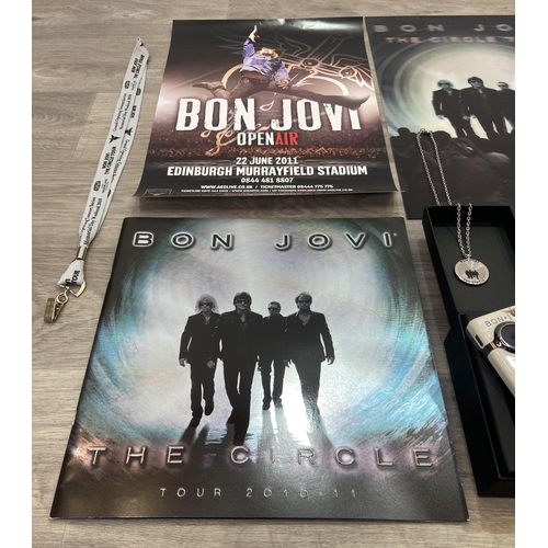 98 - Thirteen items of memorabilia from Bon Jovi's The Circle Tour 2010-2011, to include a limited editio... 