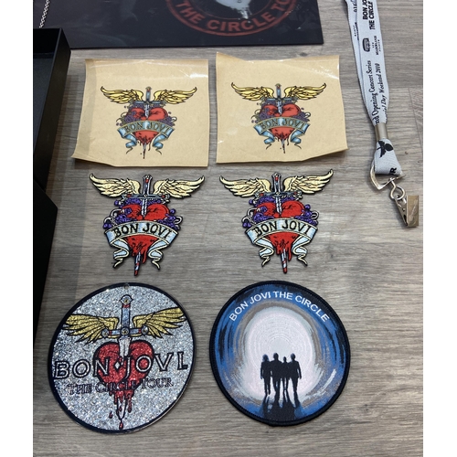 98 - Thirteen items of memorabilia from Bon Jovi's The Circle Tour 2010-2011, to include a limited editio... 