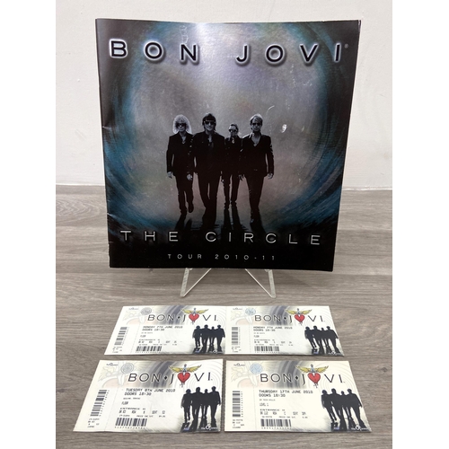 99 - An official tour programme and four tickets from Bon Jovi's 'The Circle Tour 2010-2011.' The tickets... 