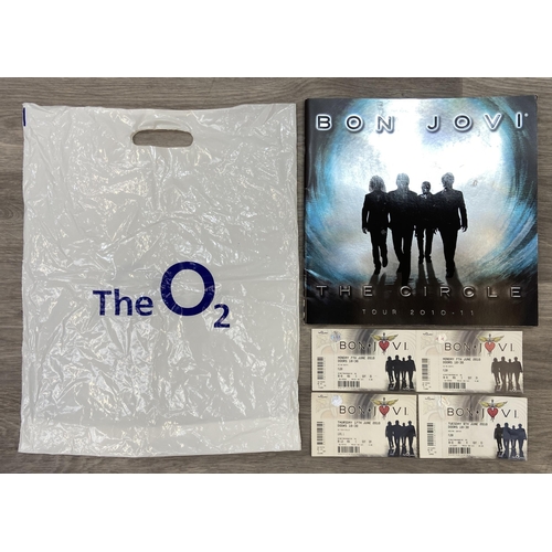 99 - An official tour programme and four tickets from Bon Jovi's 'The Circle Tour 2010-2011.' The tickets... 